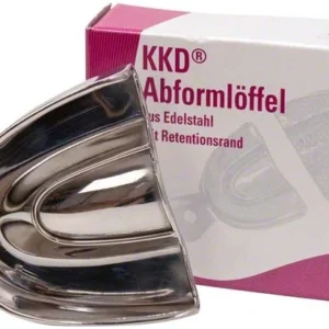 Abformlöffel aus Edelstahl vor Verpackung mit Produktinformationen.