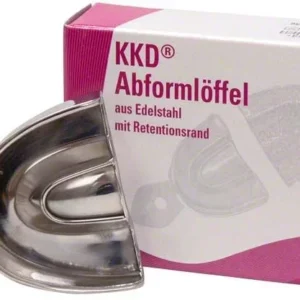 Abformlöffel aus Edelstahl mit Retentionsrand, Verpackung im Hintergrund.